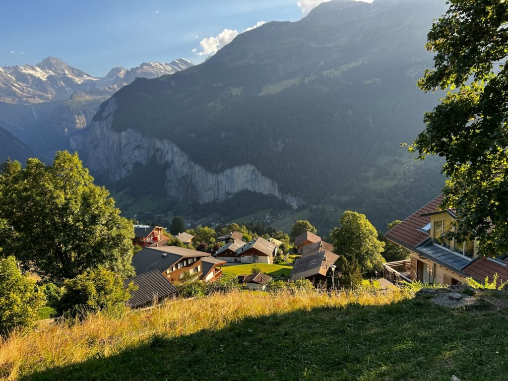 Scenic view of Lauterbrunnen Valley in Switzerland with green alpine meadows and steep cliffs